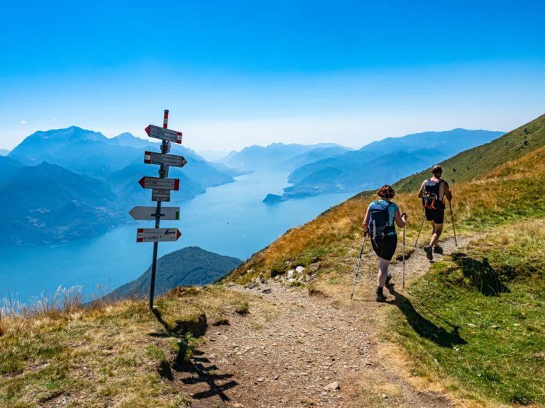 Trekking scene on Lake Como alps (the arrows indicates the names of the locations reached by the trails)