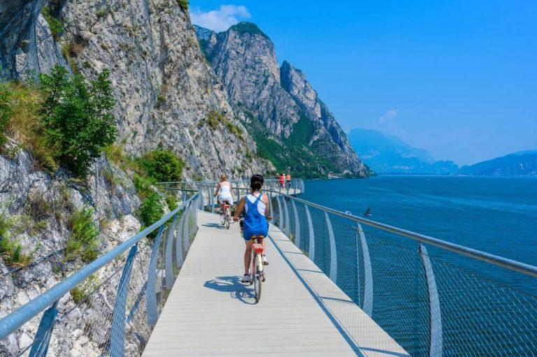 "Ciclopista del Garda" - Bicycle road and foot path over Garda lake with beautiful landscape scenery at Limone Sul Garda - travel destination in Brescia, Italy