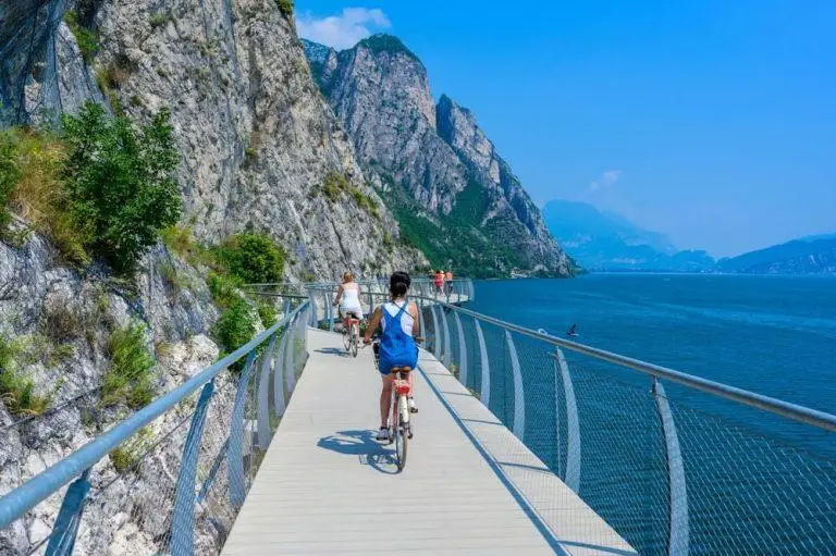 "Ciclopista del Garda" - Bicycle road and foot path over Garda lake with beautiful landscape scenery at Limone Sul Garda - travel destination in Brescia, Italy