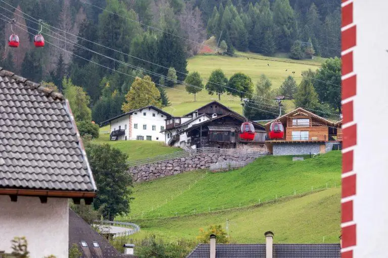 Ortisei Italy street Mont Seuc cable car cabins